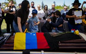CORRECTS ROLAND TO RONALD - FILE - The widow, son, and sister of former Venezuelan dissident military officer Ronald Ojeda, bury him at the Canaan Cemetery in Santiago, Chile, March 8, 2024, after he was kidnapped and his body was found buried on the outskirts of the capital. Chile will request the extradition of two Venezuelan citizens who allegedly participated in Ojeda's kidnapping and murder, according to the Chilean prosecutor's office on April 12, 2024. (AP Photo/Esteban Felix, File)