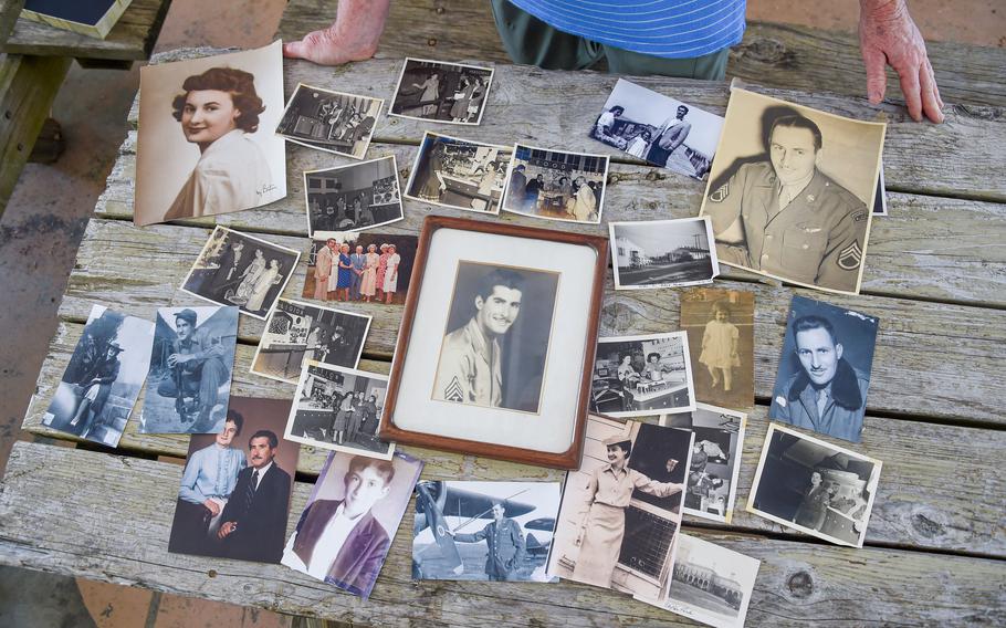 Denise Sharp displays old photos of her family, many of whom were in the military, including her father Donald Doerer, center, a World War II veteran. Sharp's father was the first cousin and best friend of Earle V. Hann Jr. of Baltimore, who we now know died aboard the HMT Rohna in one of the worst maritime disasters in U.S. military history, though the incident was kept quiet. No photos of Hann are known to exist.