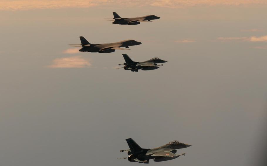 Two Air Force B-1 Lancer bombers fly alongside Japan Air Self-Defense Force fighers over the Sea of Japan, also known as the East Sea, Wednesday, Aug. 30, 2023.