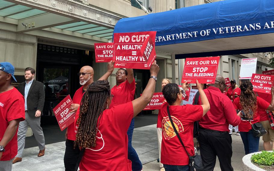 Nurses wearing red T-shirts marched outside the central office of the Department of Veterans Affairs in Washington on Thursday, June 6, 2024. The nurses said they were protesting chronic staffing vacancies at VA hospitals and clinics that include a shortage of 13,000 nurses.