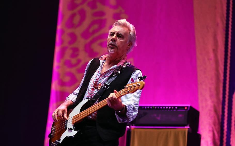 Sex Pistols bassist Glen Matlock performs during a concert.