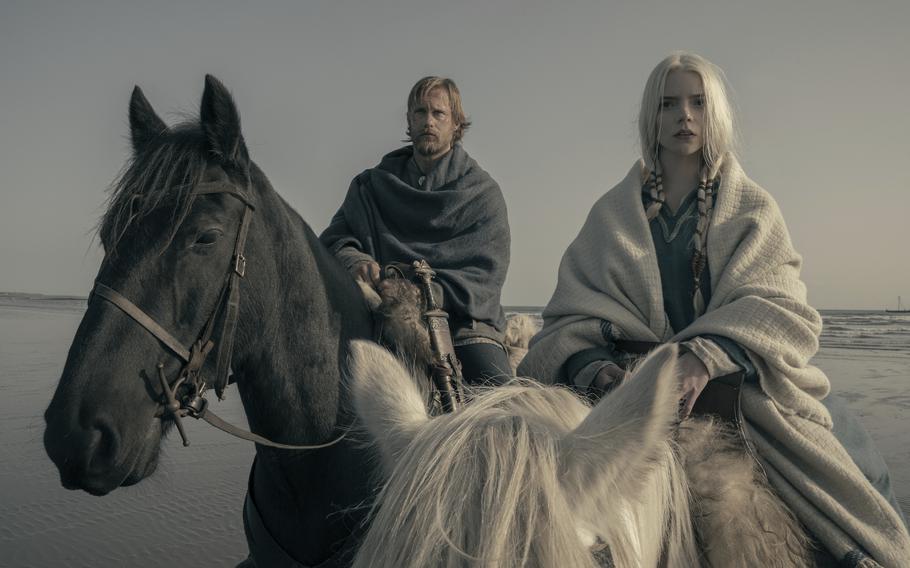 This image released by Focus Features shows Alexander Skarsgård, left, and Anya Taylor-Joy in a scene from “The Northman.” 