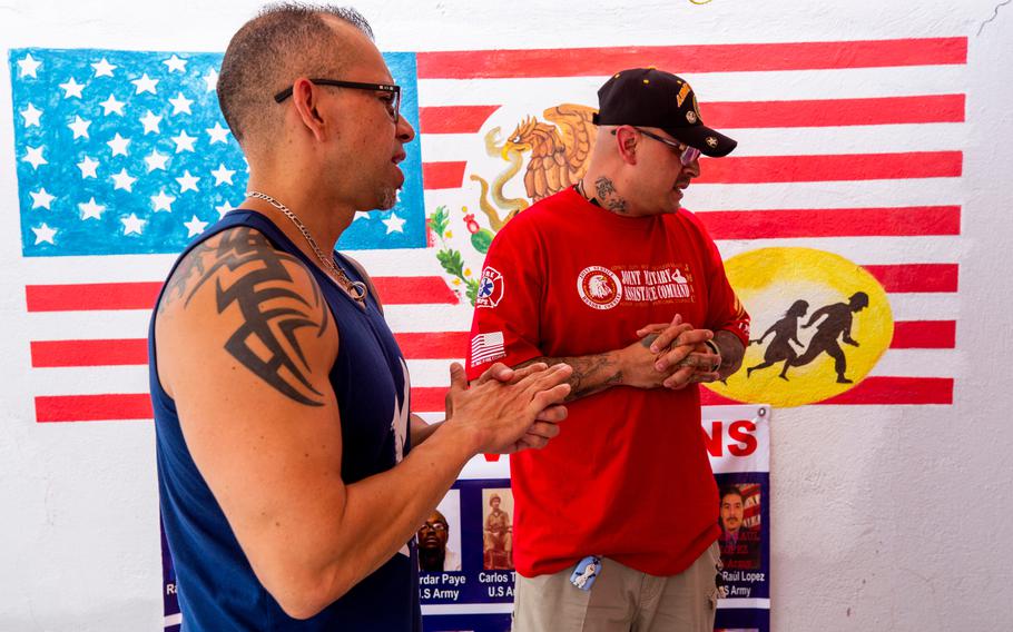 From left, Michael Evans and fellow deported veteran Ivan Ocon talk about life in Mexico at the “Juarez Bunker,” a support shelter for deported veterans in Cuidad Juarez.