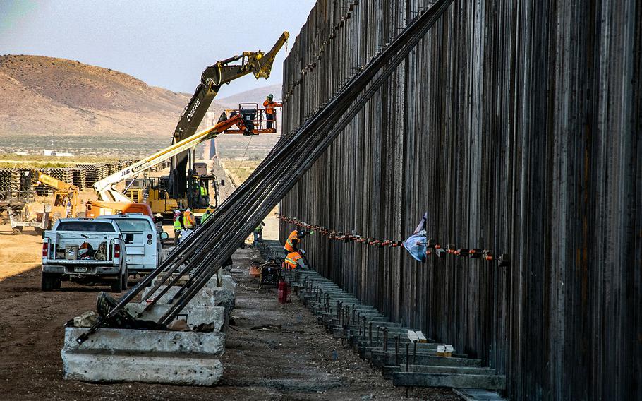 A U.S. Army Corps of Engineers South Pacific Border District contractor crew places a bollard style barrier panel along the U.S.-Mexico border near Antelope Wells, New Mexico, Oct. 6, 2020. 