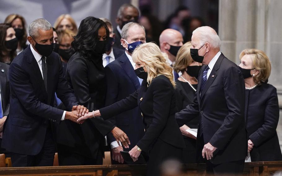 President Joe Biden and first lady Jill Biden arrive and greet from left, former President Barack Obama, former first lady Michelle Obama, former President George W. Bush, former first lady Laura Bush and former Secretary of State Hillary Clinton before the funeral for former Secretary of State Colin Powell at the Washington National Cathedral, in Washington, Friday, Nov. 5, 2021.