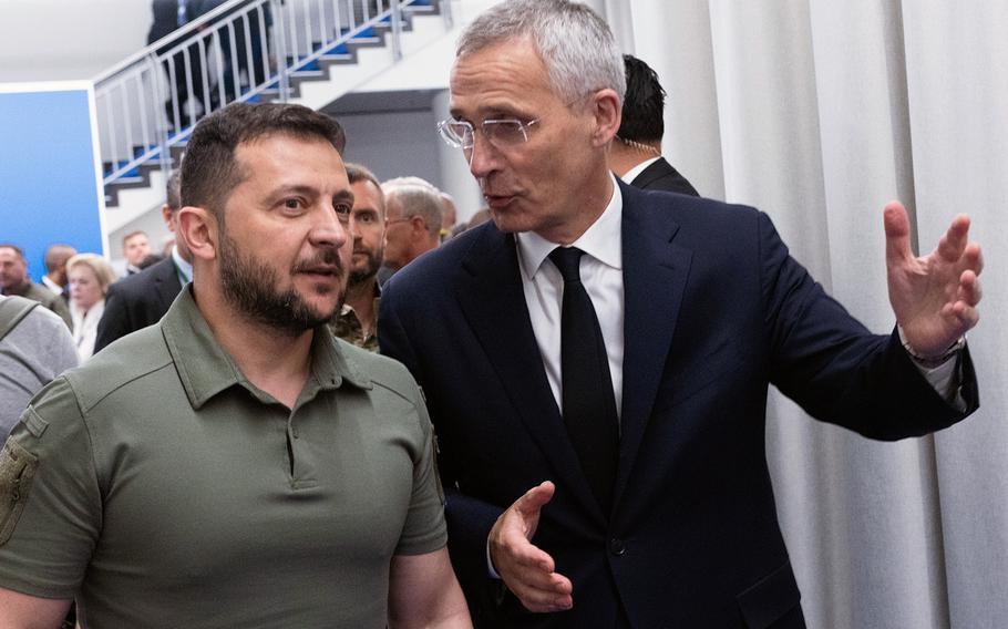 Ukrainian President Volodymyr Zelenskyy, left, listens to NATO Secretary-General Jens Stoltenberg on the final day of NATOs two-day summit in Vilnius, Lithuania, July 12, 2023. Zelenskyy was on hand to attend the inaugural meeting of the newly formed Ukraine-NATO Council.  