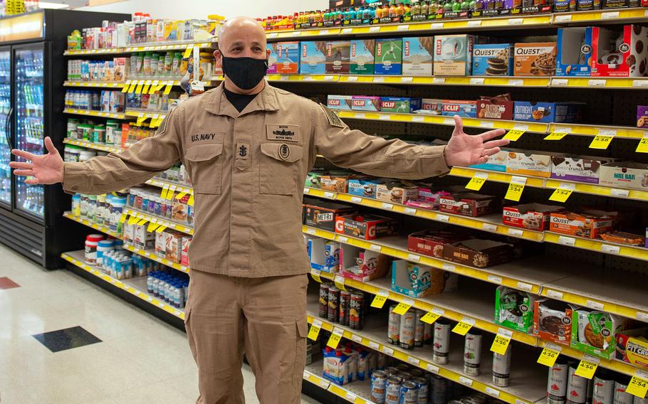 Master Chief Petty Officer of the Navy Russell Smith visits a Navy Exchange in Homeport Hampton Roads Iowa Estates, Va., during a military housing tour, Jan. 28, 2022. Smith is testing a new flame-resistant khaki working uniform, which will be an alternative to coveralls and provided to sailors at no cost to them.