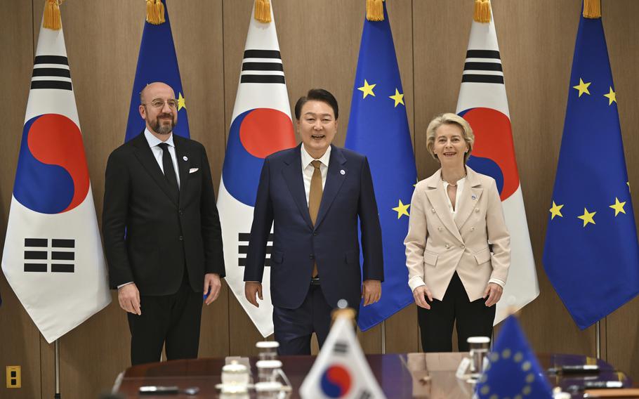 South Korea's President Yoon Suk Yeol, center, poses for a photo with European Council President Charles Michel, left, and European Commission President Ursula von der Leyen during their meeting at the Presidential Office in Seoul Monday, May 22, 2023.