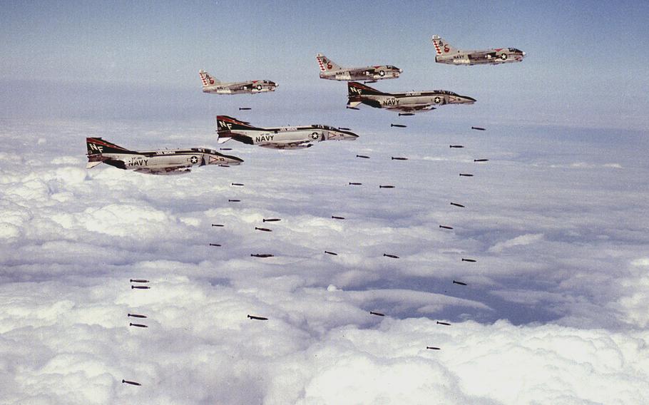 Three U.S. Navy F-4B Phantom IIs and three A-7C Corsair IIs on a bombing mission over Vietnam in March 1973.