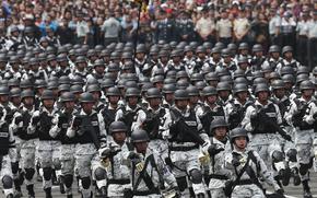 Members of Mexico's National Guard march in the Independence Day military parade, in the capital's main plaza, the Zocalo, in Mexico City, Sept. 16, 2019. 