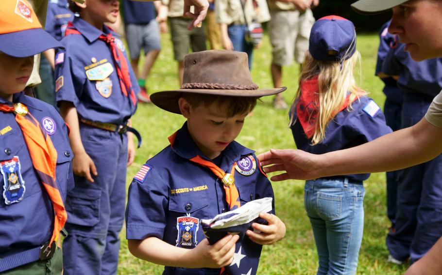 Yokosuka Pack 33 Cubmaster Susan Duenas explains why old American flags are cremated during a ceremony at Ikego West Valley Campground near Yokosuka Naval Base, Japan, May 6, 2023.