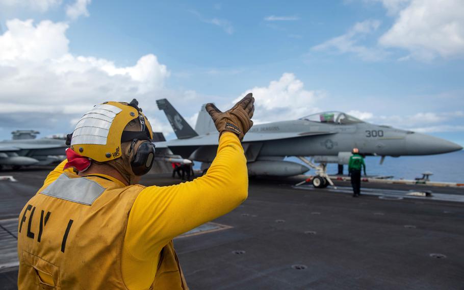 An F/A-18E Super Hornet prepares to take off from the aircraft carrier USS Carl Vinson in the South China Sea, Monday, Sept. 6, 2021. 