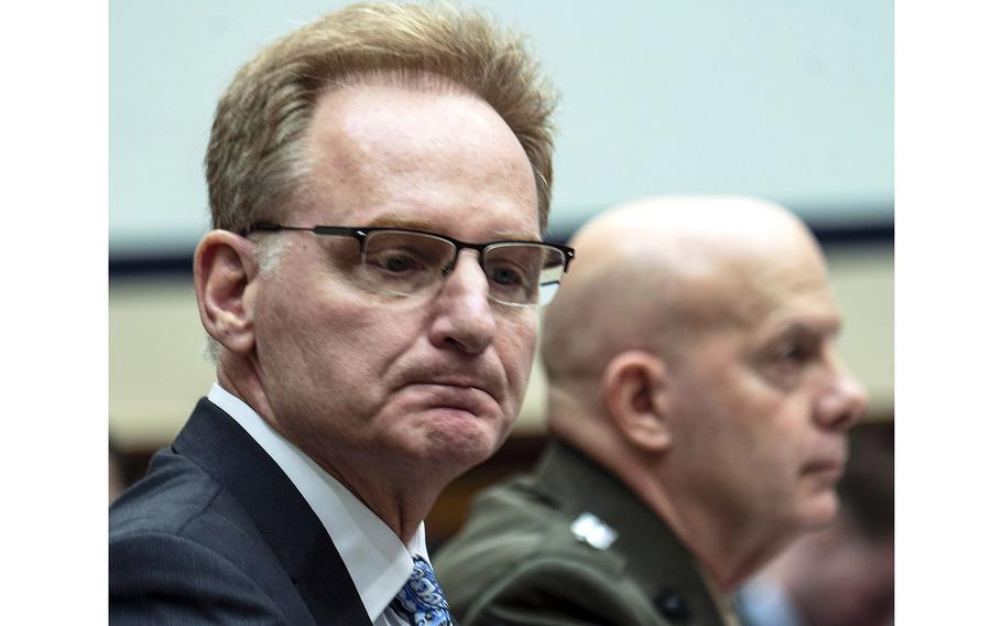 Acting Secretary of the Navy Thomas Modly, left, at a House Armed Services Committee hearing in February 2020. At right is Marine Corps Commandant Gen. David Berger.