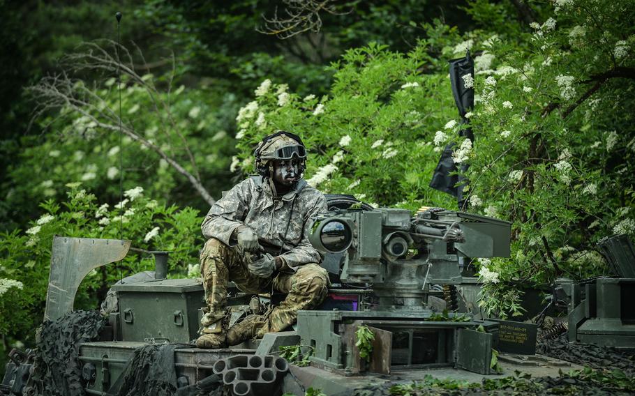 An M1 Abrams crew member waits for crew instructions during Exercise Combined Resolve 17 at the Joint Multinational Readiness Center, in Hohenfels, Germany, June 8, 2022. Combined Resolve is a U.S. Army exercise involving 5,600 U.S. service members, allies, and partners from more than 10 countries.