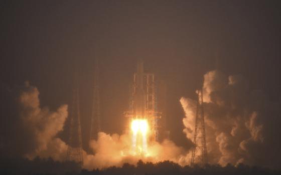 In this photo provided by China's Xinhua News Agency, a Long March-5 rocket, carrying the Chang'e-6 spacecraft, blasts off from its launchpad at the Wenchang Space Launch Site in Wenchang, south China's Hainan Province, Friday, May 3, 2024. China on Friday launched a lunar probe to land on the far side of the moon and return with samples that could provide insights into differences between the less-explored region and the better-known near side.