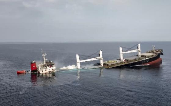 A ship sinks into the sea.