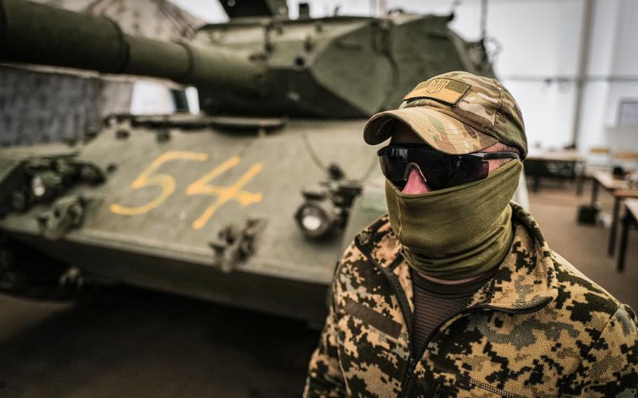 Lt. Sergei, a Ukrainian tank commander, stands in front of a Leopard 1 A5 tank at the Klietz training range June 23, 2024.