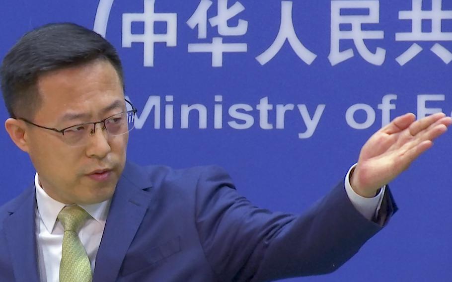 Chinese Foreign Ministry spokesperson Zhao Lijian invites questions during a briefing at the Foreign Ministry in Beijing, China, on Tuesday, Nov. 23, 2021.