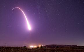 This image taken with a slow shutter speed on Oct. 2, 2019, and provided by the U.S. Air Force shows an unarmed Minuteman 3 intercontinental ballistic missile test launch at Vandenberg Air Force Base, Calif.