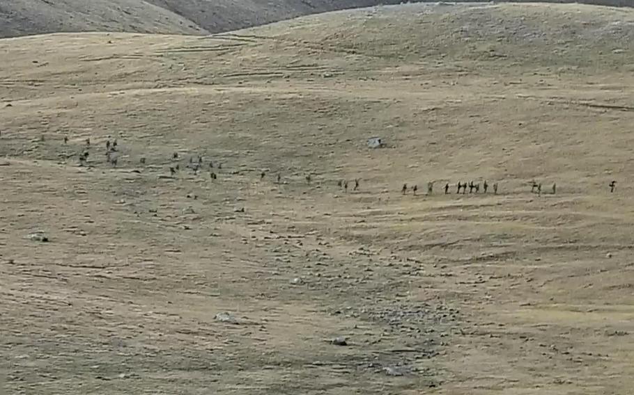 This image taken from a YouTube footage released by Armenian Defense Ministry on  Sept. 13, 2022, shows Azerbaijanian service members crossing the Armenian-Azerbaijani border and approaching the Armenian positions. 