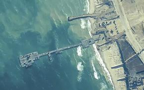 The image provided by U.S, Central Command, shows U.S. Army soldiers assigned to the 7th Transportation Brigade (Expeditionary), U.S. Navy sailors assigned to Amphibious Construction Battalion 1, and Israel Defense Forces placing the Trident Pier on the coast of Gaza Strip on Thursday, May 16, 2024. The temporary pier is part of the Joint Logistics Over-the-Shore capability. The U.S. military finished installing the floating pier on Thursday, with officials poised to begin ferrying badly needed humanitarian aid into the enclave besieged over seven months of intense fighting in the Israel-Hamas war. 