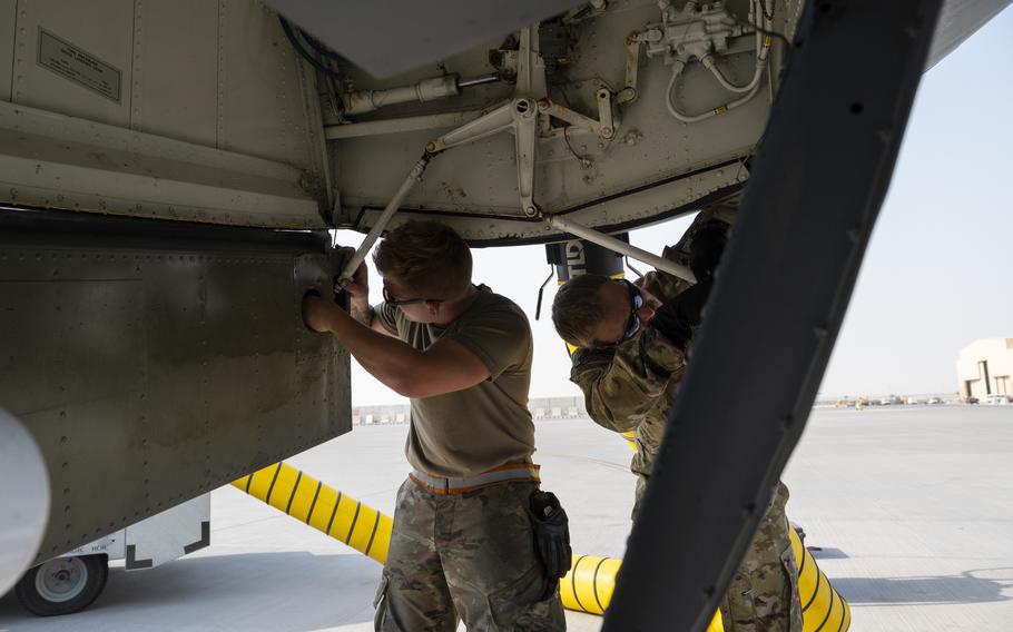 U.S. Air Force aircrew members assigned to the 340th Expeditionary Air Refueling Squadron inspect the outside of a U.S. Air Force KC-135 Stratotanker assigned to the 340th EARS before flight operations at Al Udeid Air Base, Qatar, April 6, 2022.