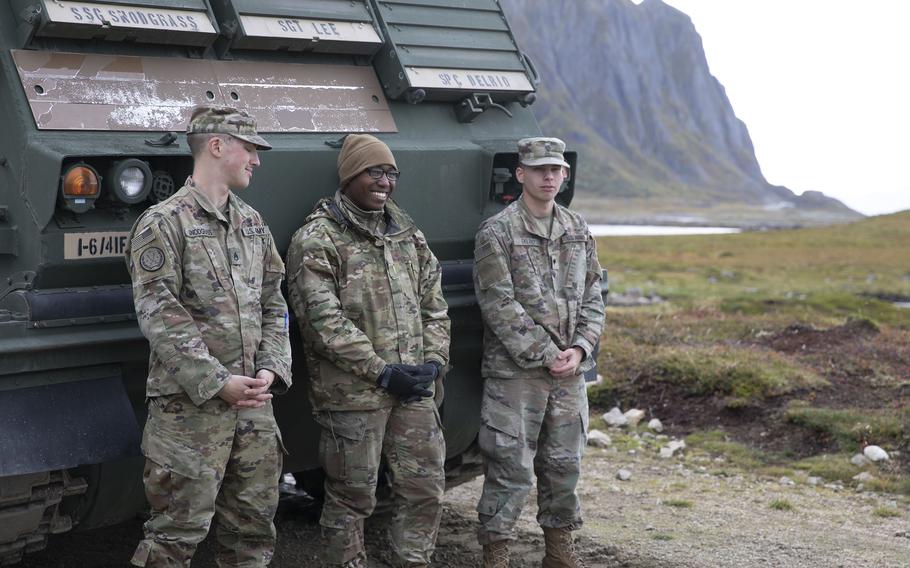 A section of Multiple Launch Rocket System crewmen, assigned to 1st Battalion, 6th Field Artillery Regiment, 41st Field Artillery Brigade, relax before firing their artillery during the Thunder Cloud live-fire exercise in Andoya, Norway, on Sept. 15, 2021. 