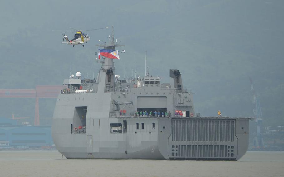 A helicopter prepares to land on the Philippine navy's strategic sealift vessel BRP Davao del Sur during an amphibious landing exercise at the lighthouse beach facing south China sea in Subic Freeport in Subic town, north of Manila on September 21, 2019, as part of a combined exercise between army, navy, air force and marines. 