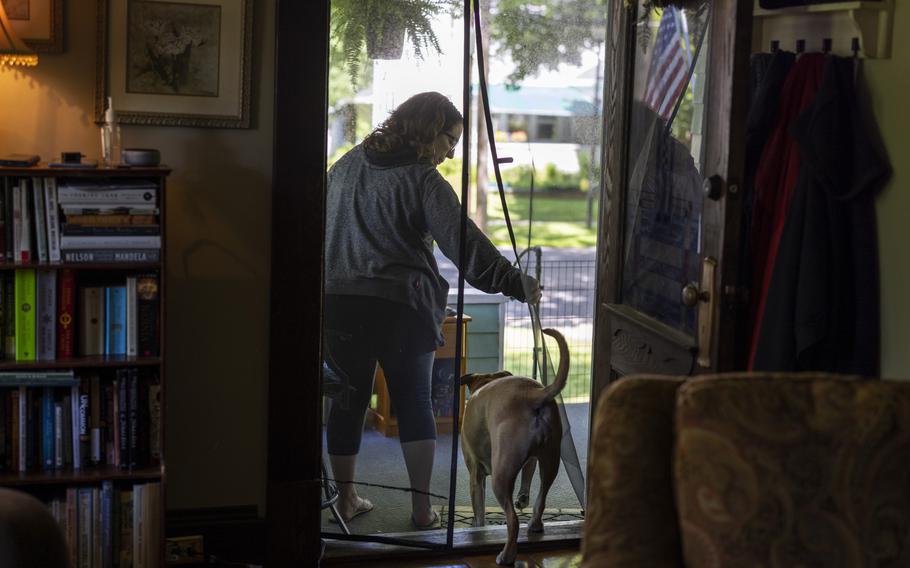 Kim Staffieri at her home in Fairport, N.Y., on June 13, 2022. Staffieri set up a workstation on her front porch, from where she volunteers to help Afghans who assisted the U.S. government during 20 years of war. 