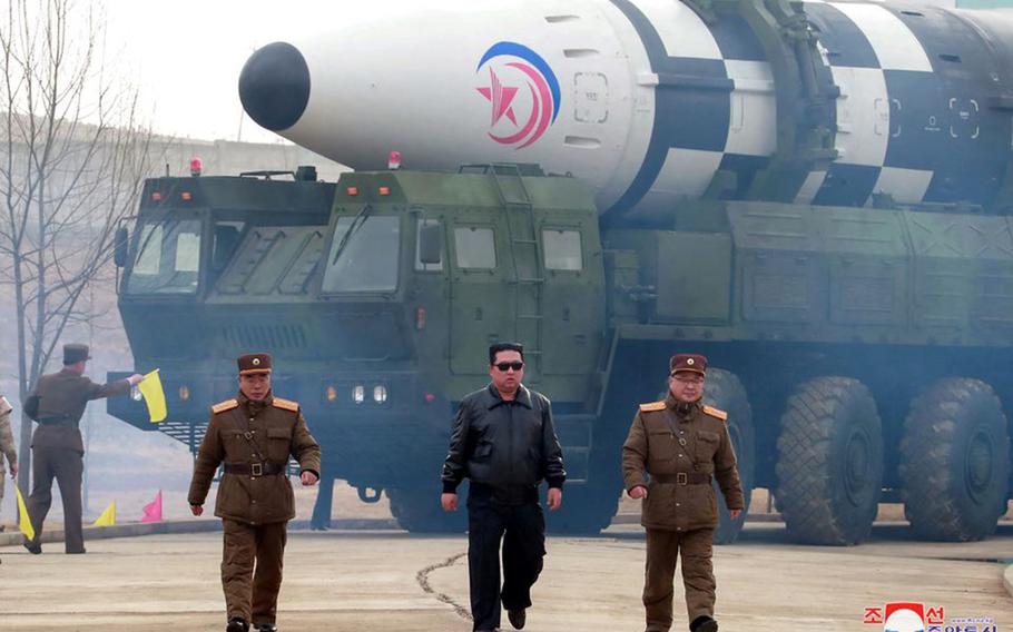 North Korean leader Kim Jong Un walks near an intercontinental ballistic missile in this undated photo from the state-run Korean Central News Agency.