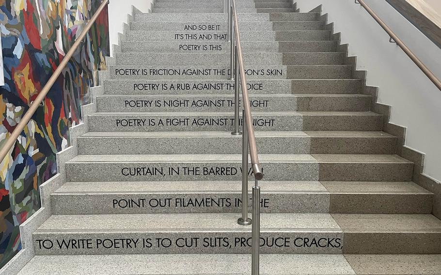 A stairwell in the new Vicenza High School in the Villagio housing community displays a poem by Italian poet Emilio Villa. The poem is one of many design elements thoughout the school that seek to teach students something as they go from class to class.