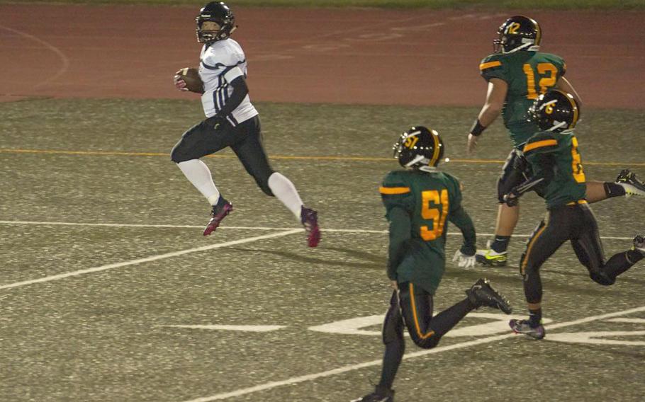 Zama's Kaisei Muta outruns the Robert D. Edgren offense to the end zone for a 48-yard interception-return touchdown.