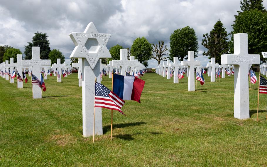 The cemetery, filled iwth white crosses and Stars of David.