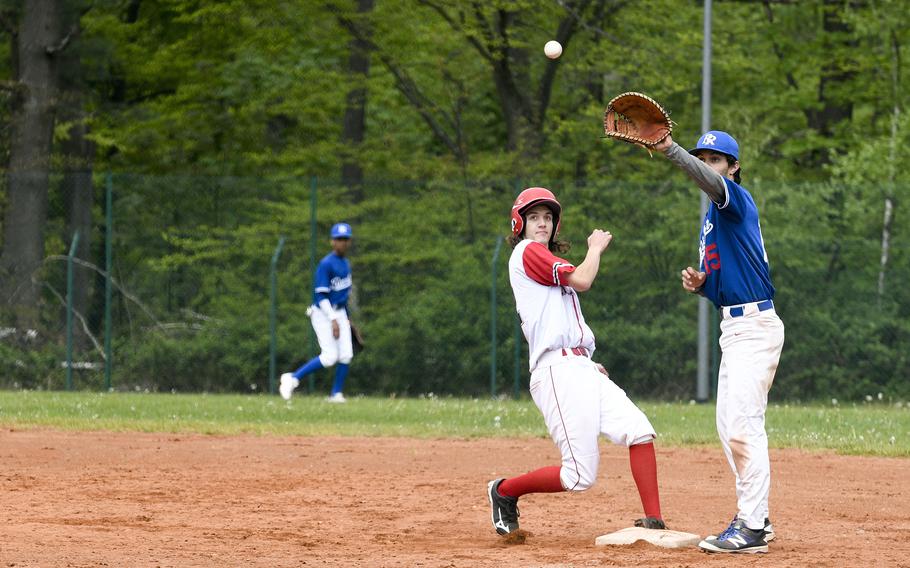 Kaiserslautern's Anderson Ennis scoots back to first base before Ramstein's C.J. Delp can get the ball during a pickoff attempt in a game on Saturday, April 30, 2022, in Kaiserslautern, Germany.