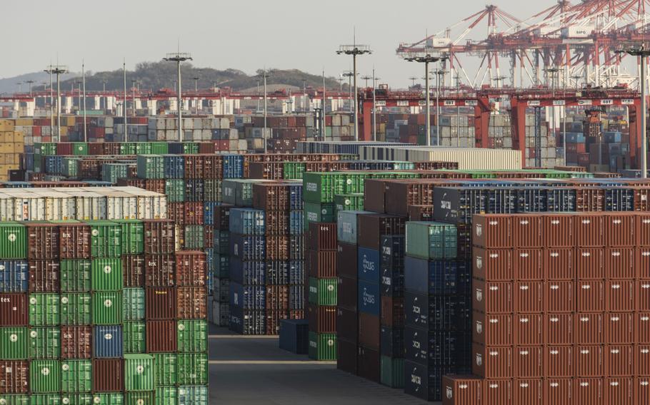 Gantry cranes and shipping containers at the Yangshan Deepwater Port in Shanghai on Jan. 11.