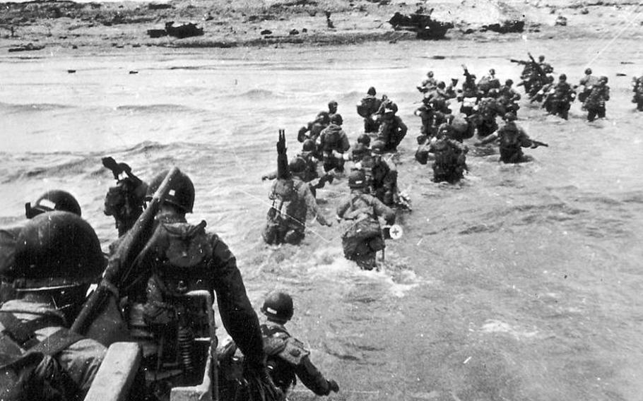 Allied forces wade ashore on Utah Beach in Normandy, France, on D-Day, June 6, 1944.