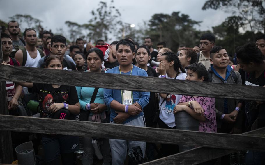 Migrants planning to start walking across the Darien Gap from Colombia to Panama in hopes of reaching the U.S. gather at the trailhead camp in Acandi, Colombia, Tuesday, May 9, 2023. The image was part of a series by Associated Press photographers Ivan Valencia, Eduardo Verdugo, Felix Marquez, Marco Ugarte Fernando Llano, Eric Gay, Gregory Bull and Christian Chavez that won the 2024 Pulitzer Prize for feature photography.