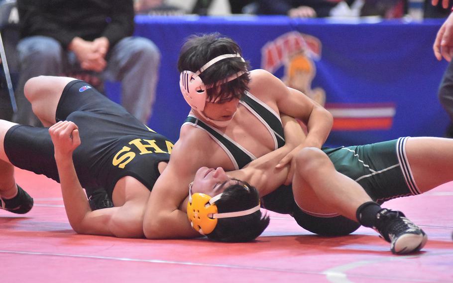 Naples' Lucas Suszko gets set to pin Vicenza's Eric Gastelum at 132 pounds Saturday, Feb. 4, 2023, at the DODEA-Europe Southern Europe regional at Aviano Air Base, Italy.