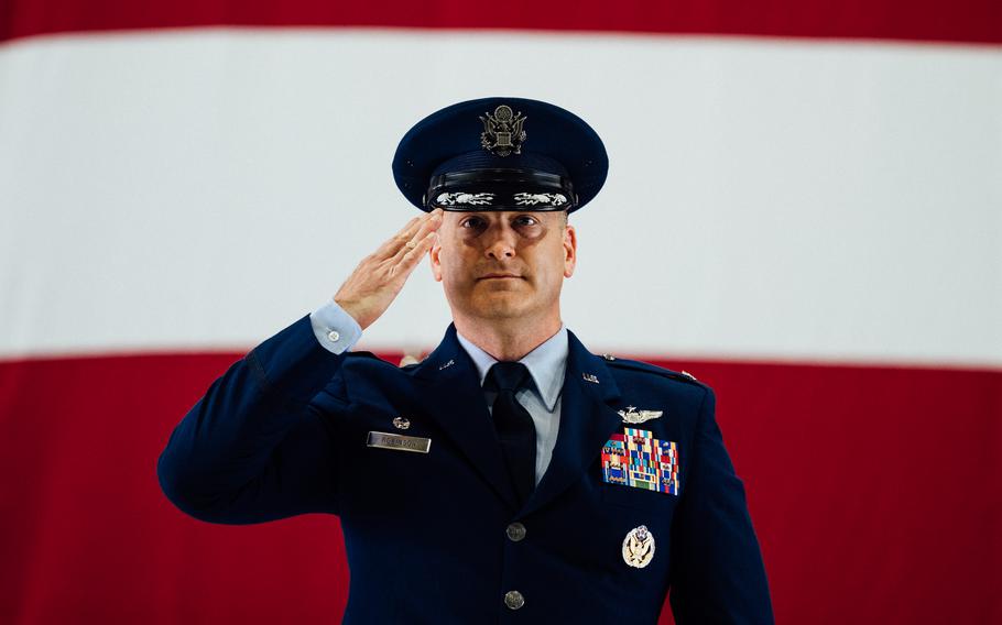 Col. Chris Robinson, 375th Air Mobility Wing commander, renders his first salute to members of Team Scott and the Showcase Wing after assuming command of the 375th AMW on Scott Air Force Base, Ill., July 1, 2021. 