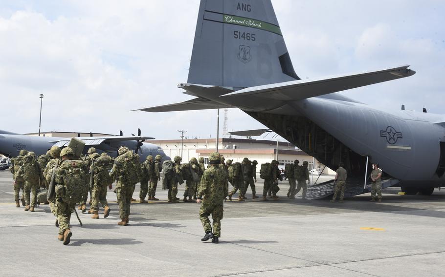 Japan Ground Self-Defense Force soldiers board a U.S. C-130J  Super Hercules during a Valiant Shield exercise at Yokota Air Base, Japan, on Saturday, June 15, 2024. 