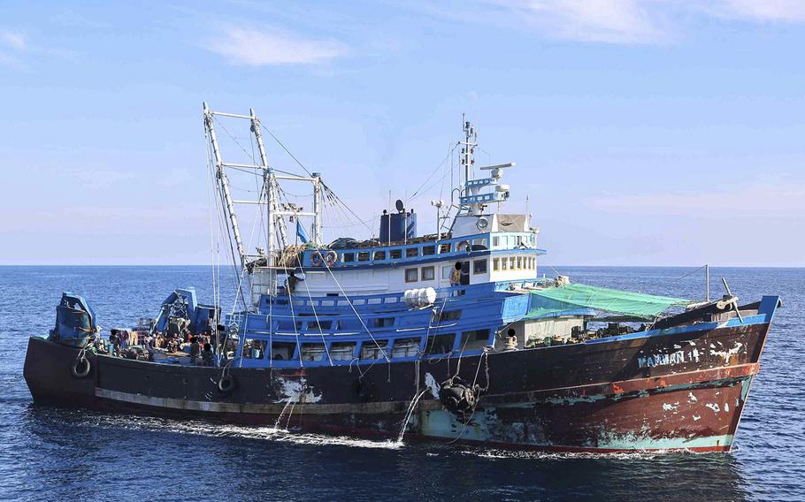 The U.S. Navy released photos of a fishing trawler it says carried more than 50 tons of ammunition rounds, fuses and propellants for rockets when it was boarded Dec. 1., 2022 in the Gulf of Oman.