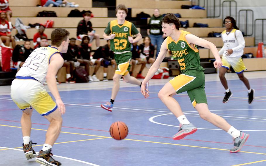 SHAPE's Bela Clobes drives on the fast break during pool play at the Division I DODEA European Basketball Championships on Wednesday at Ramstein High School on Ramstein Air Base, Germany.