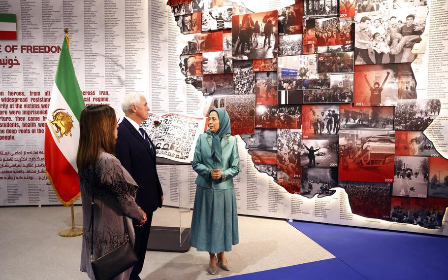 Former U.S. Vice President Mike Pence, center, with his wife Karen Pence, left, accompanied by the leader of the People’s Mujahedin of Iran Maryam Rajavi visit the Iranian opposition headquarters in Albania, where up to 3,000 MEK members reside at Ashraf-3 camp in Manza town, about 16 miles west of Tirana, Albania, Thursday, June 23, 2022. 