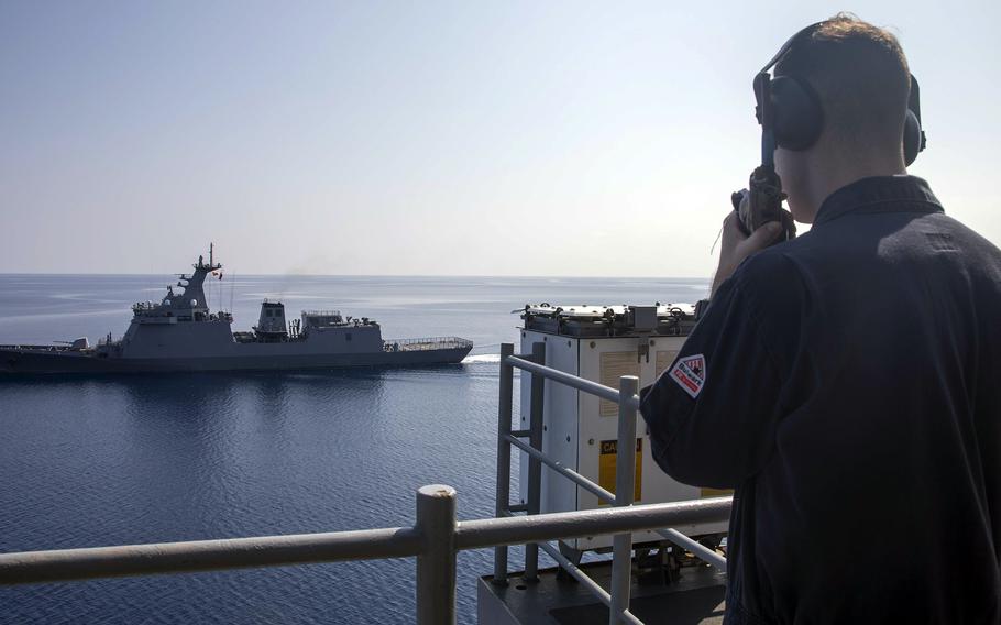 The amphibious assault ship USS Makin Island practices a replenishment-at-sea with Philippine navy ship BRP Jose Rizal, Saturday, April 15, 2023.