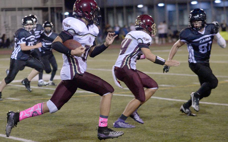 Matthew C. Perry running back Nickolas Elizondo gets an escort around right end.