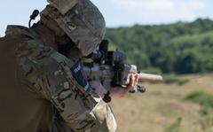 U.S. Army soldier locates enemy targets during the European Best Sniper competition at Hohenfels training area, Germany, Aug. 8, 2022. Service members from 18 different countries compete as part of the Joint Multination Readiness Centers competition to find the best sniper in Europe.