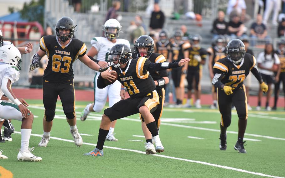Vicenza quarterback Maxwell Thrash tries to juke Naples defenders Friday, Sept. 20, 2024, in the Cougars’ 28-6 loss to the Wildcats.