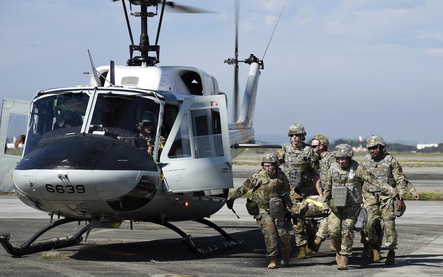 Air Force medics practice treating mass casulaties from an enemy drone strike at Yokota Air Base, Japan, Oct. 20, 2023.