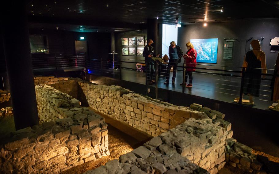 Visitors look at the remnants of the Isis and Mater Magna shrine in Mainz, Germany, on Nov. 10, 2022. The temple was discovered in the early 2000s during construction of a shopping mall. 