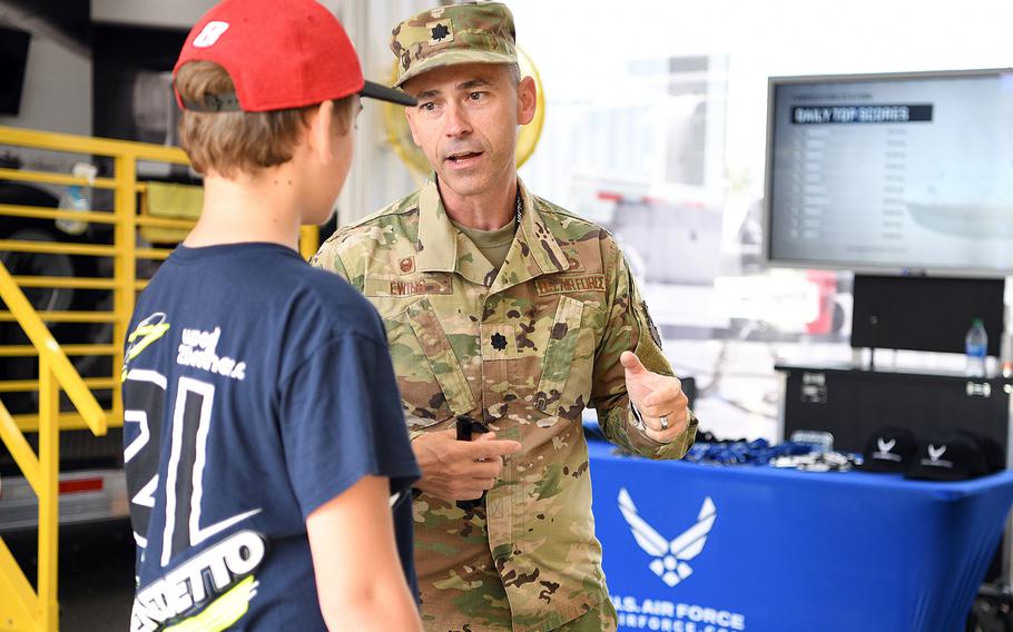 Lt. Col. Bryan Ewing, the 332nd Recruiting Squadron commander, talks to a visitor Sept. 18, 2021, in Bristol, Tenn. The Air Force is facing its biggest recruiting challenge in decades, says Maj. Gen. Ed Thomas, the head of of the service’s recruitment command.